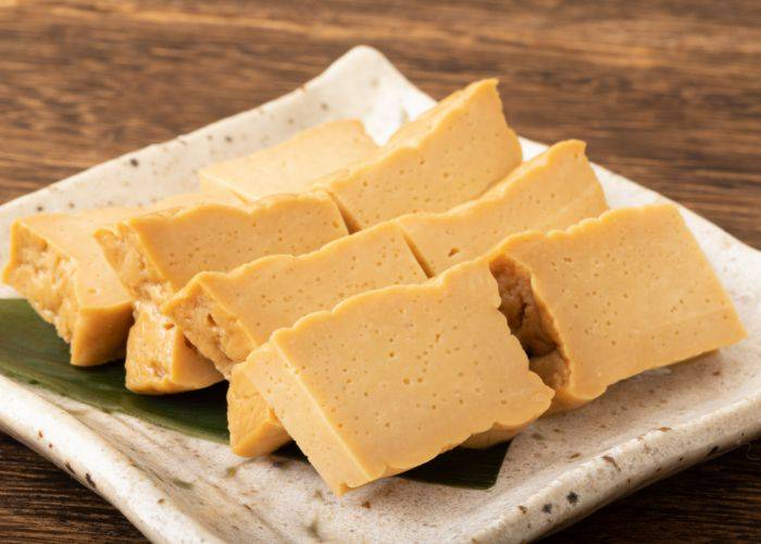 Thick blocks of miso paste on a ceramic serving tray,